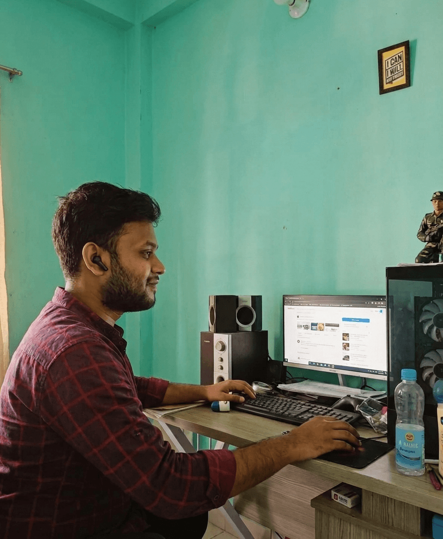 Masud Rana working at his desk